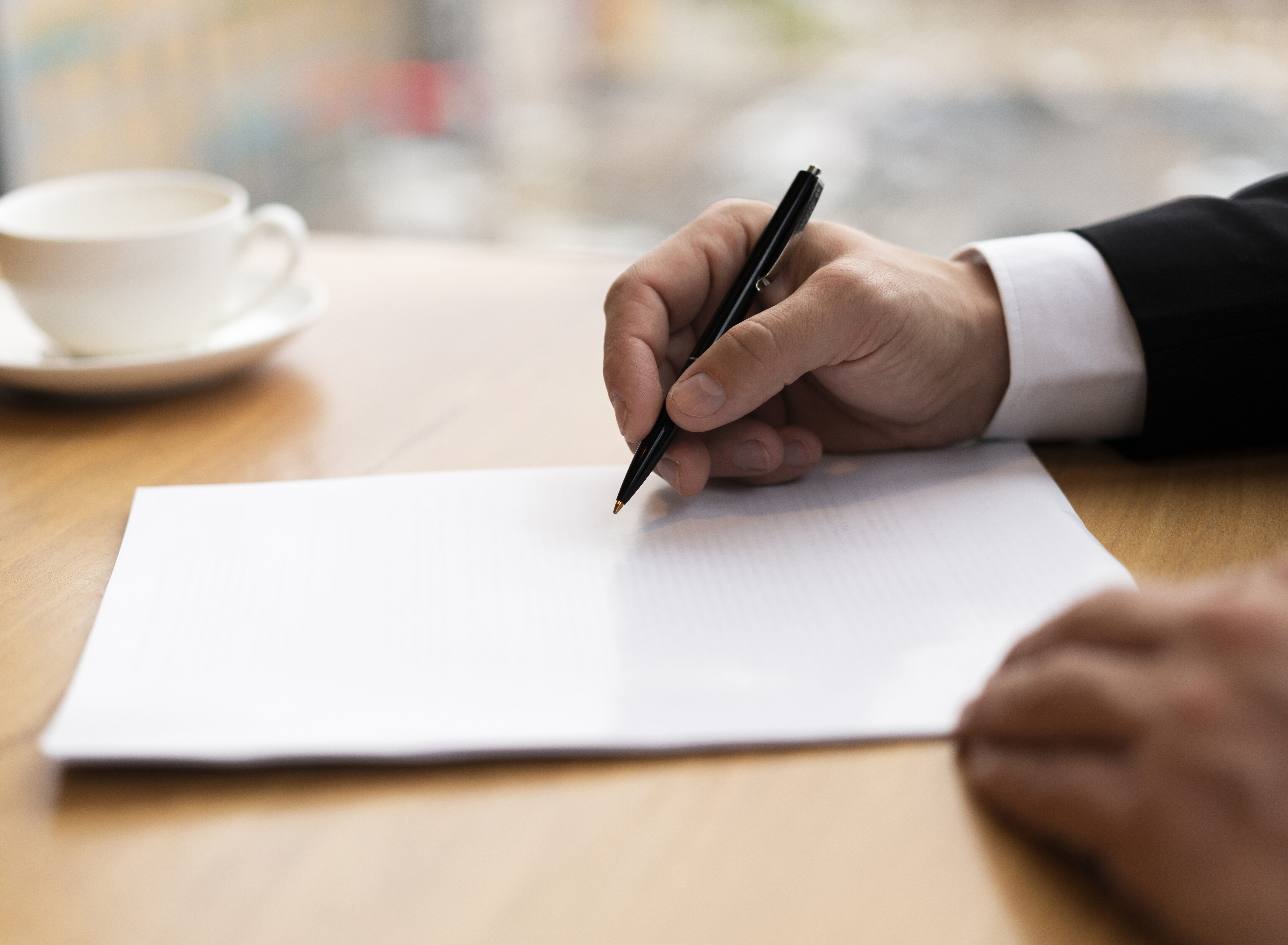 Missouri Probate Lawyer signing paperwork.