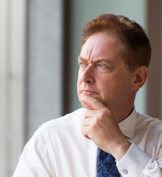 Older adult considering future care needs and long-term planning options